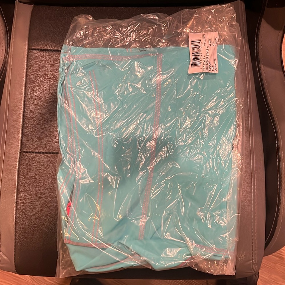 Hurley Board Shorts new in packaging. Turquoise blue with orange stitching.